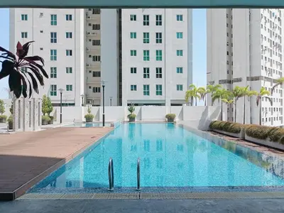 a large swimming pool with buildings in the background at Deluxe Suites 5, 2-4 pax , Netflix, Georgetown in Jelutong