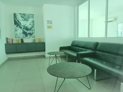 a living room with a couch and a table at Deluxe Suites 5, 2-4 pax , Netflix, Georgetown in Jelutong