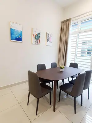 a dining room with a wooden table and chairs at JOVIAL SingleStorey Bungalow 4Room10Pax `Alma in Bukit Mertajam