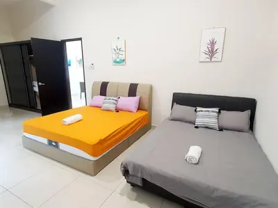 two beds sitting next to each other in a room at JOVIAL SingleStorey Bungalow 4Room10Pax `Alma in Bukit Mertajam