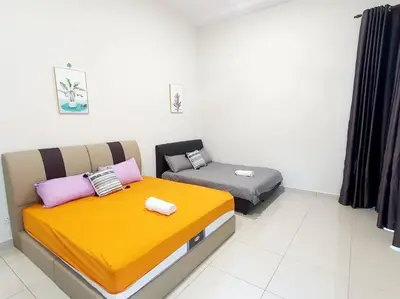 two beds sitting next to each other in a room at JOVIAL SingleStorey Bungalow 4Room10Pax `Alma in Bukit Mertajam