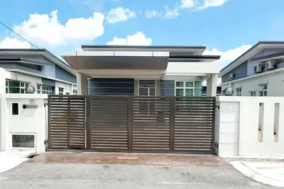 a house with a wooden gate in front of it at JOVIAL SingleStorey Bungalow 4Room10Pax `Alma in Bukit Mertajam