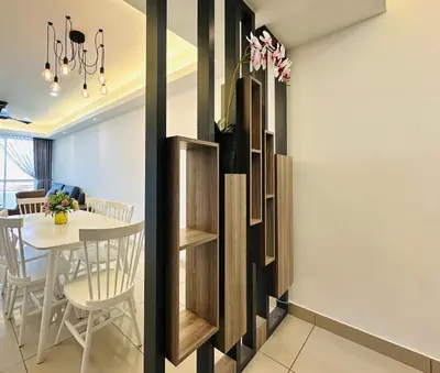 a dining room with a table and chairs and shelves at The Majestic Ipoh Town - Mountain View in Ipoh