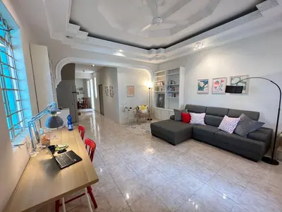a living room with a couch and a table at myRoom Georgetown, Off Jalan Burma, Gurney Drive in George Town