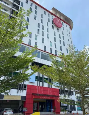 a hotel building with a sign on the side of it at Sense Hotel Taiping in Taiping