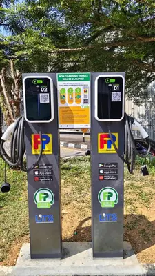 two parking meters are standing next to each other at Sense Hotel Taiping in Taiping