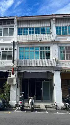 a building with a scooter parked in front of it at Aayu Chulia - Chulia St, George Town in George Town