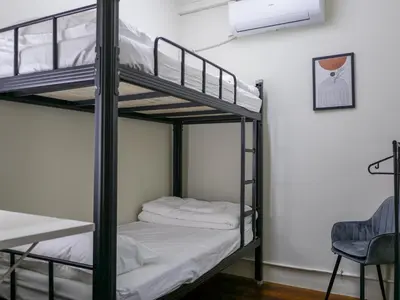a couple of bunk beds in a room at Aayu Chulia - Chulia St, George Town in George Town