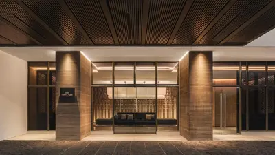 a lobby with a couch in the middle of a building at Crowne Plaza Penang Straits City by IHG in Perai