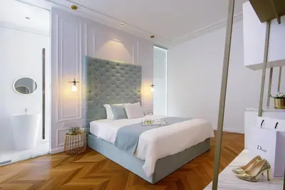 a bedroom with a large bed with a blue headboard at Georgetown Luxury Heritage House 4BR 10Pax in George Town