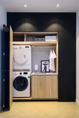 a washer and dryer in a kitchen with black cabinets at Georgetown Luxury Heritage House 4BR 10Pax in George Town