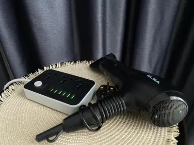 a blow dryer sitting on a table next to a microphone at Urban Suites Georgetown, Penang in Jelutong