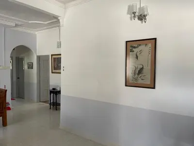 a white wall with a picture on it at Kiri Kanan Bukit Homestay Kuala Kubu Bahru \u5de6\u6797\u53f3\u820d in Kuala Kubu Baharu