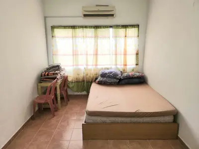 a small room with a bed and a window at Reyza Homestay KKB in Kuala Kubu Baharu