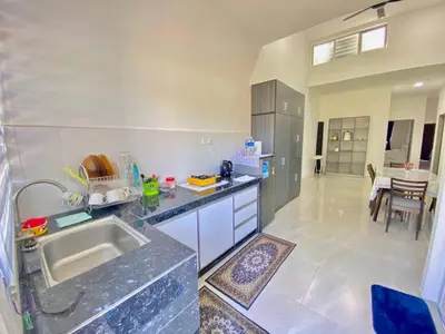 a kitchen with a sink and a counter top at Rumah Inap Che'Gu Baha in Teluk Intan