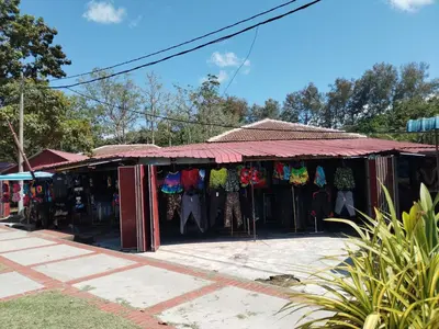 a store with clothes on display in a street at Teluk Batik Holiday Apartment in Lumut