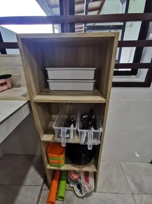 a wooden shelf with a bowl and dishes on it at Ipoh stadium 1min/wahkeongpark simee 18pax bungalow cottage in Ipoh