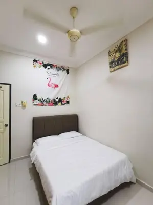 a bedroom with a large white bed in a room at Ipoh stadium 1min/wahkeongpark simee 18pax bungalow cottage in Ipoh