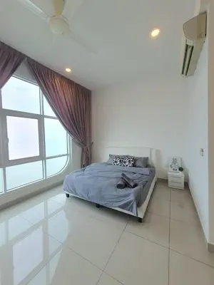 a bedroom with a bed and a large window at Seaview Condo 10pax #10minQueensbay #15minSpice in Bayan Lepas