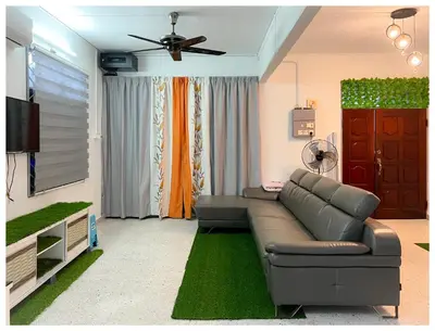 a living room with a couch and a tv at ✩ 23 HOUSE ✩ 23号 复古老宅 ✩ Vintage Homestay in Butterworth