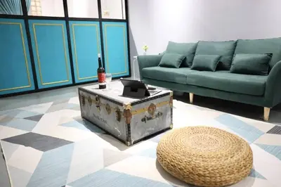 a living room with a couch and a coffee table at Studio S Conceptual Homestay Station 18 - Ipoh in Ipoh
