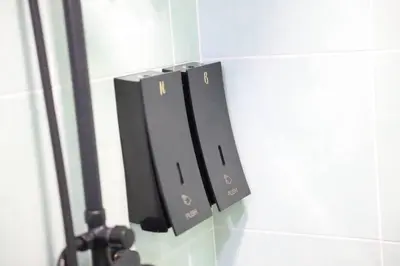 a black object on a wall with a lightswitch at Studio S Conceptual Homestay Station 18 - Ipoh in Ipoh