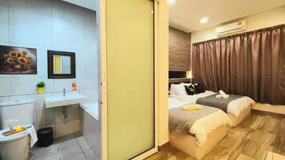 a bedroom with a bed and a bathroom with a sink at Ipoh City Modern Homestay Octagon 5-6 pax Apartment Suite Free Parking by City Home Empire in Ipoh