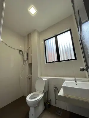 a bathroom with a toilet and a sink and a window at 4 Bedroom 4 PRIVATE BATHROOM 4B12B 5 min City Center in Ipoh