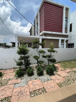 a house with two trees in front of a building at 4 Bedroom 4 PRIVATE BATHROOM 4B12B 5 min City Center in Ipoh