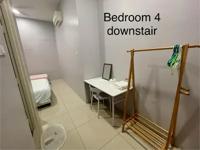 a bathroom with a small table and a bathroom downstairs at 4 Bedroom 4 PRIVATE BATHROOM 4B12B 5 min City Center in Ipoh