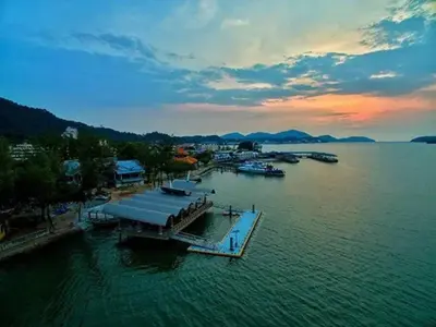an aerial view of a dock with boats in the water at lumut manjung homestay john faten in Lumut