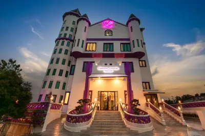 a large white building with stairs in front at Cameron Lavender Mansion by PLAY in Brinchang