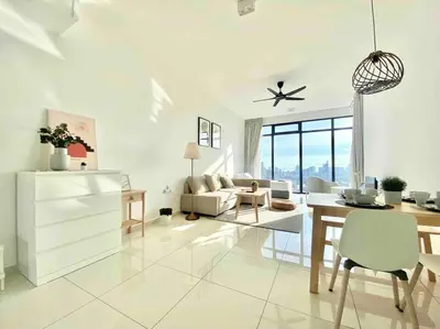a white living room with a table and a couch at Beacon Executive Suites #Warmth suite #Rooftop pool #Georgetown in George Town
