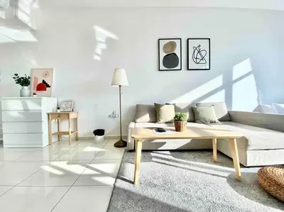 a living room with a couch and a coffee table at Beacon Executive Suites #Warmth suite #Rooftop pool #Georgetown in George Town