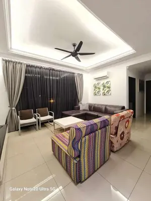 a living room with a couch and a ceiling fan at Aiera Homestay @ Meru Casa Kayangan in Ipoh