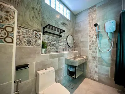a bathroom with a toilet and a sink at DoSomething Guest House 5 in Ipoh