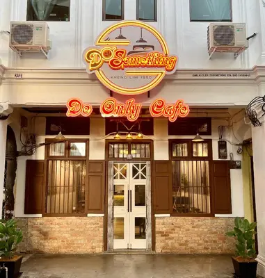 a restaurant with a sign that reads do only cafe at DoSomething Guest House 5 in Ipoh