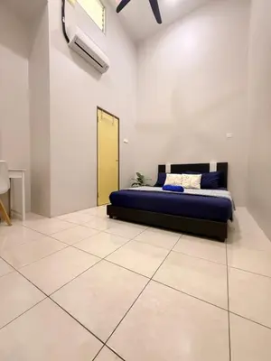 a bedroom with a bed and a yellow door at QM_Homestay Bagan Serai in Bagan Serai