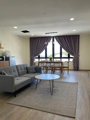 a living room with a couch and a table at Secret Garden @ Cameron Centrum in Brinchang
