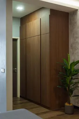 a large wooden cabinet in a room with a plant at Luxury Seaview Projector Lounge by The Only Bnb in Tanjong Tokong
