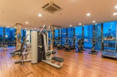 a gym with exercise equipment and a view of the city at Luxury Seaview Projector Lounge by The Only Bnb in Tanjong Tokong