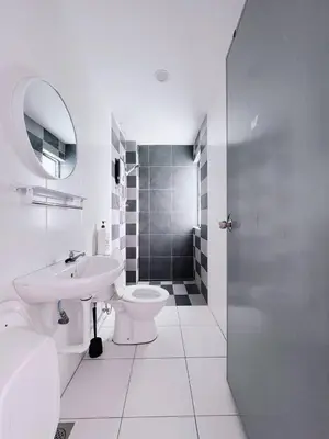 a bathroom with a sink and a toilet and a shower at Manhanttan Ipoh Waterpark Homestay By Warmth Stay 4-7pax 3BR in Ipoh