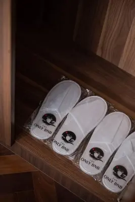 a group of white shoes sitting on a shelf at Family Seaview Suite with 3 Rooms by The Only Bnb in Tanjong Tokong