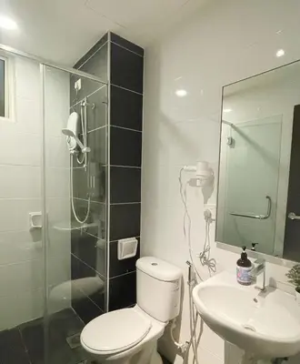 a bathroom with a toilet and a sink and a shower at JS Ipoh Homestay @ The Majestic Ipoh in Ipoh