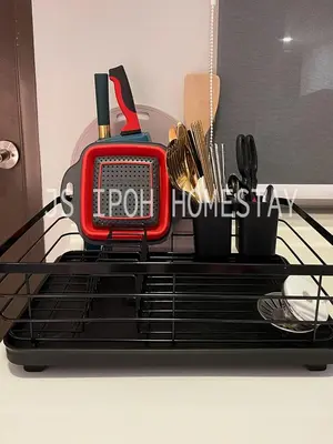 a red light on a shelf with utensils at JS Ipoh Homestay @ The Majestic Ipoh in Ipoh