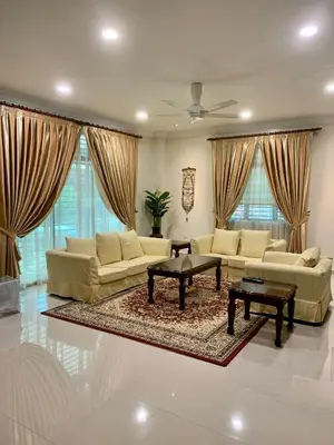 a large living room with couches and a table at Puncak Villa 10-20pax in Kuala Kangsar