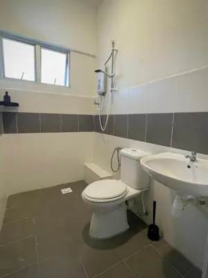 a bathroom with a toilet and a sink at Biella Homestay Apartment for Muslim in Tanah Rata