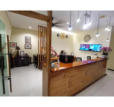 a lobby of a salon with a counter at Hotel O Pavilion Inn Hotel in Lumut