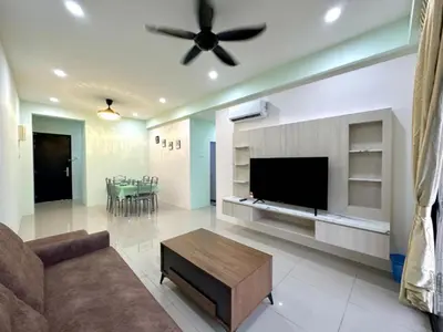 a living room with a couch and a flat screen tv at Ipoh Simple Homestay by Comfort Home in Ipoh