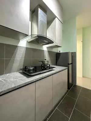 a kitchen with a stove and a counter top at Ipoh Simple Homestay by Comfort Home in Ipoh